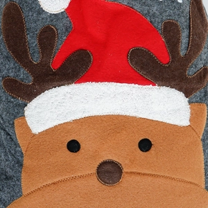 Detailed view of the felt reindeer decoration with cozy fleece textures and clear stitching