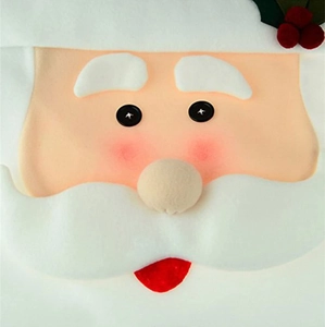 Detailed view of handmade felt Santa chair cover with 3D nose and holly berry accent