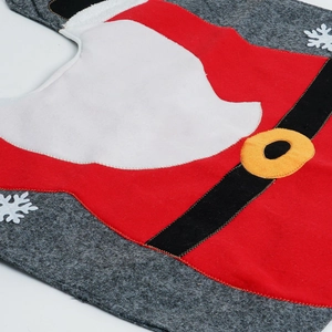 Detailed close-up of Santa Claus themed toilet cover with snowflake patterns and belt