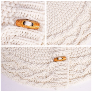 Detailed view of white knitted mini tree skirt with cable stitch and wood button