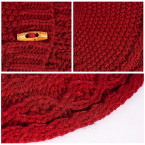 Macro shot of red cable knit Christmas tree skirt with a natural wooden horn button