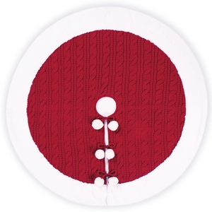 Red cable knit Christmas tree skirt with white plush trim and pom-pom ties on white background