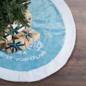Blue Christmas tree skirt with white fur trim and embroidered Winter Wonderland text