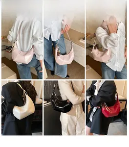 Detailed views of crossbody crescent bags in pink, beige, black, and red leather