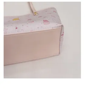 Close-up of pink tote bag showing smooth leather bottom and My Melody character pattern