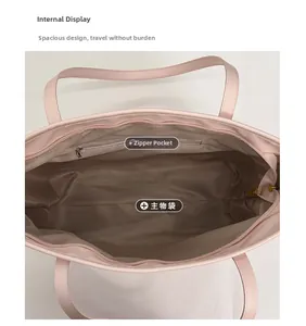 Top view of pink tote bag showing spacious brown fabric interior with zipper pocket