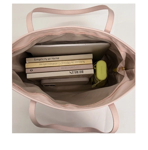 Interior view showing the large storage capacity of this pink tote bag for laptops