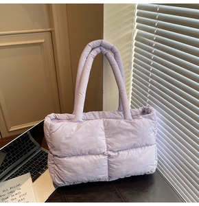 Detailed view of the soft quilted puff tote bag in light purple with a premium nylon finish