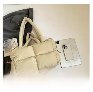 Detailed comparison showing large capacity of beige quilted puffer tote bag with iPad