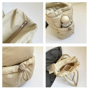 Detailed views of beige quilted puffer tote featuring side drawstring pockets and inner zip