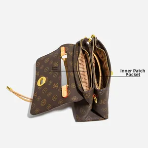 Detail view of the vintage crossbody bag with dual zipper compartments and inner pockets