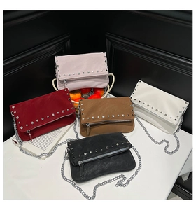 Detailed view of fashionable rivet bags in five colors with silver chain straps