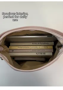 Interior view of large pink tote bag showing spacious storage for laptop and books