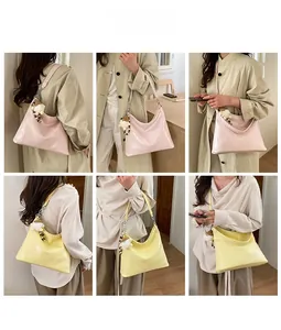 Detail showing pink and yellow shoulder bags with smooth texture and decorative charm