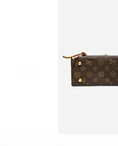 Detail shot of vintage pattern handbag with golden rivets and sturdy leather base