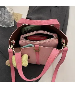 Top view of pink litchi grain tote bag showing spacious interior with inner pouch