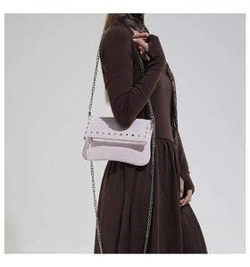Detailed view of lavender rivet chain bag on a model showing daily wear style