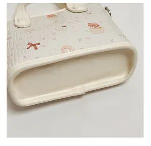 Detailed close-up of thickened reinforced bottom on cute cream cat pattern tote bag