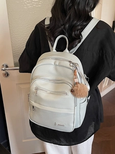Light blue faux leather backpack for women with large capacity and plush ball charm
