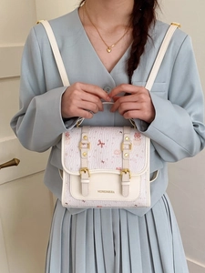 Cute preppy style mini backpack in off-white with pastel cartoon prints for women