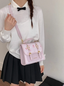 Cute lavender school-style crossbody bag with cartoon print and heart patterns for girls