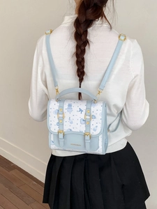 Cute preppy style light blue and white small backpack with cartoon bear patterns