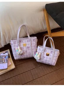 Close-up of purple quilted checkered handbags with cute bear and bow prints in 2026 style