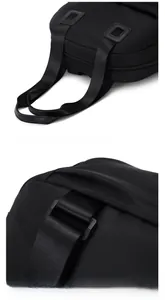 Detail of reinforced nylon handle and durable shoulder strap buckle on black backpack