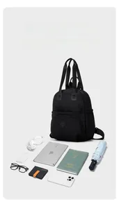 Detailed interior of a large capacity black nylon backpack with organized tech accessories
