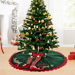 Green velvet Christmas tree skirt with elf legs decoration and festive embroidery