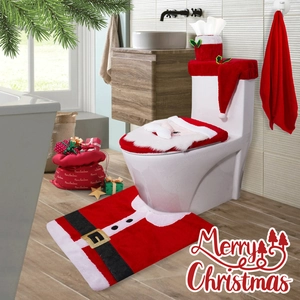 Three-piece Santa Claus bathroom set with plush toilet seat cover and matching rug