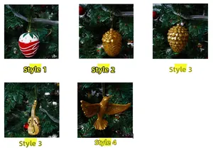 Detail of Christmas tree ornaments featuring strawberry and golden pinecone styles