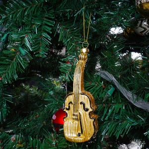Golden violin Christmas tree ornament with black string details and gold hanging cord