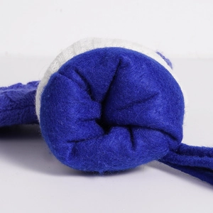 Close-up of winter earmuffs featuring soft blue fleece lining and white knit fabric