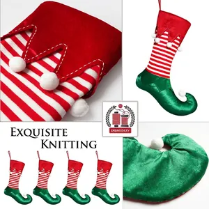 Christmas elf boots stockings with red white stripes and decorative pompoms