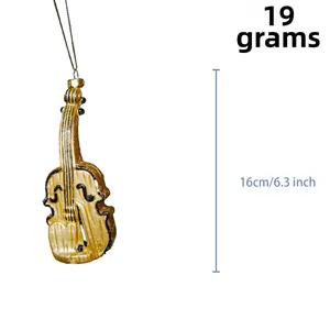 Detailed view of violin Christmas ornament in gold finish with 16cm height measurement