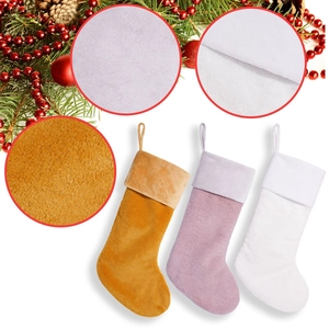 Set of three plush Christmas stockings in ginger, lavender and white for festive decor