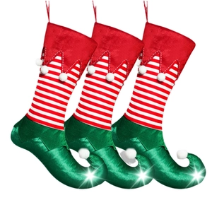 Three-piece Christmas elf boot socks set with red stripes and curled pom-pom toes