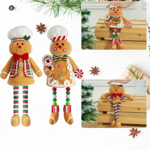 Detail of plush gingerbread man dolls featuring festive red and green holiday outfits