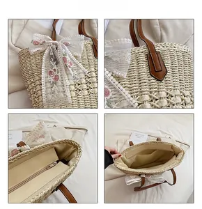 Detail view of straw tote bag showing lace bow embroidery, leather handle and inner lining