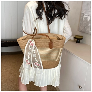 Large straw tote bag with floral embroidery scarf shown on a shoulder