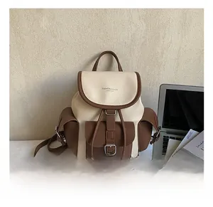 Macro detail of contrast color vintage leather backpack with drawstring and magnetic buckle