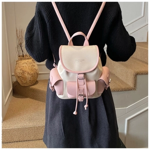 Detail of a beige and pink color-block backpack with drawstring and gold logo