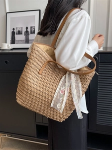 Straw bucket tote bag with leather straps and floral lace ribbon for spring vacation
