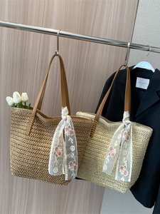 Handwoven straw bucket tote bags with leather straps and decorative floral lace scarves