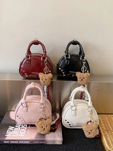 Chic mini bowling bags in four colors with cute plush bear charms and silver rivets