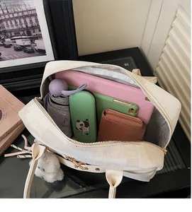 Top view of large cream woven tote bag showing spacious interior with daily essentials