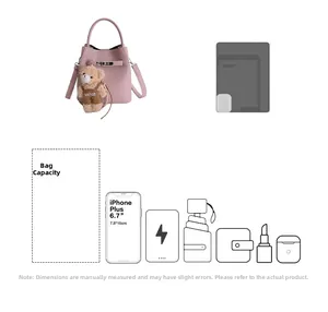 Pink bucket bag with silver lock and bear charm showing internal capacity layout