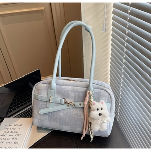 Light blue PU leather tote bag with denim texture, crossbody strap, and plush puppy charm