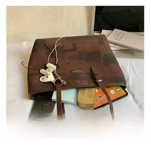 Spacious interior of a contrast-color tote bag holding gadgets and daily essentials
